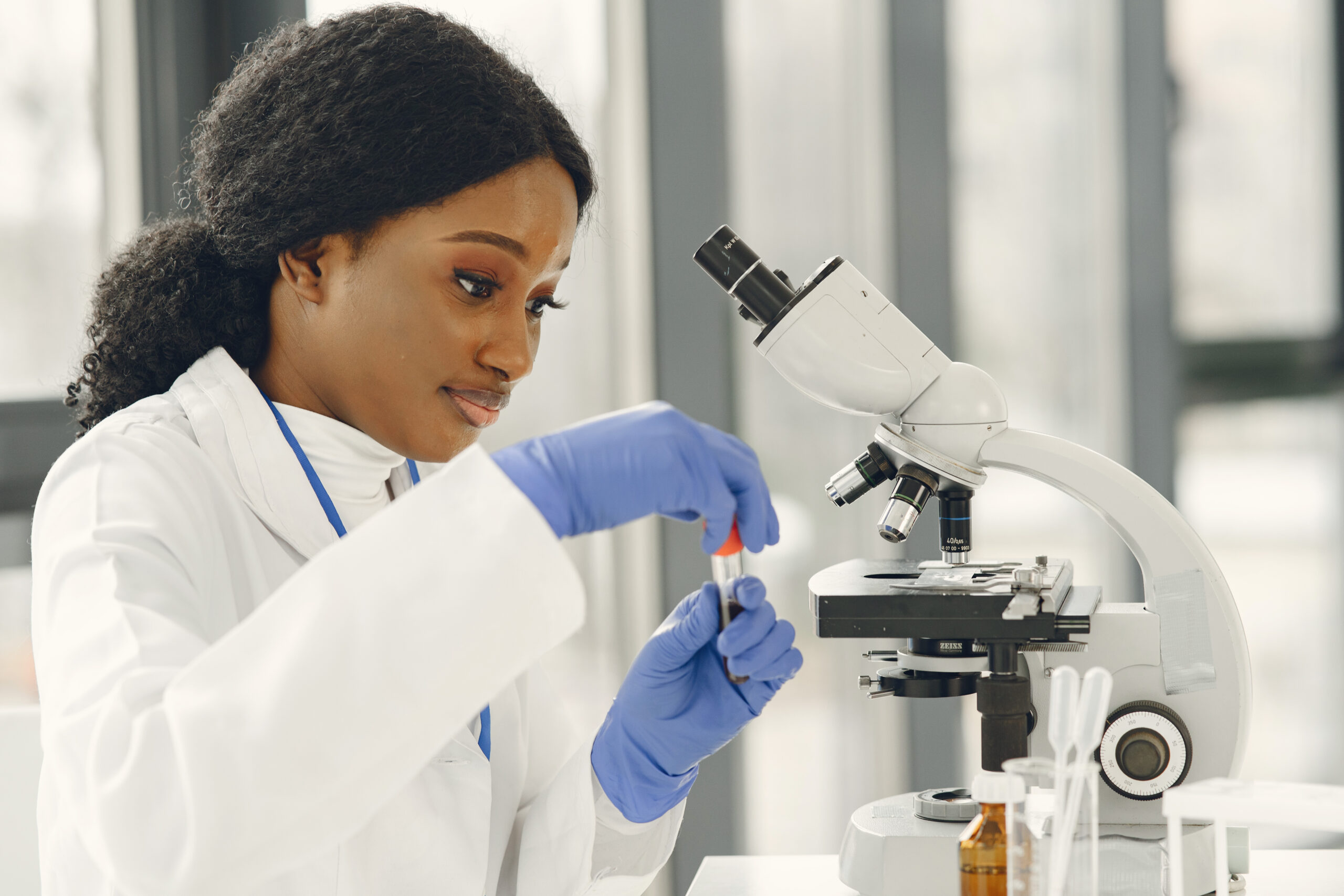 Female Scientist Working in The Laboratory Using a Microscope